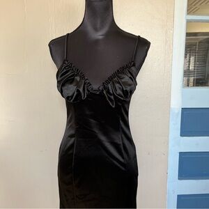 Black babydoll mini dress with ruffle detail